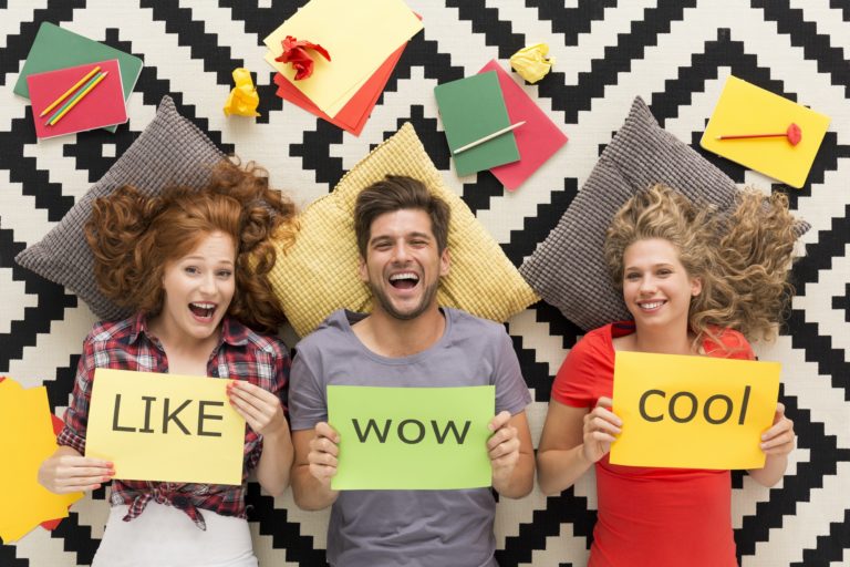 Young people lying on carpet and laughing