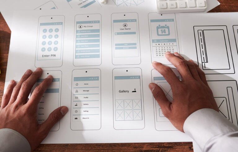 UX Designer Checking Mobile App Mock-ups