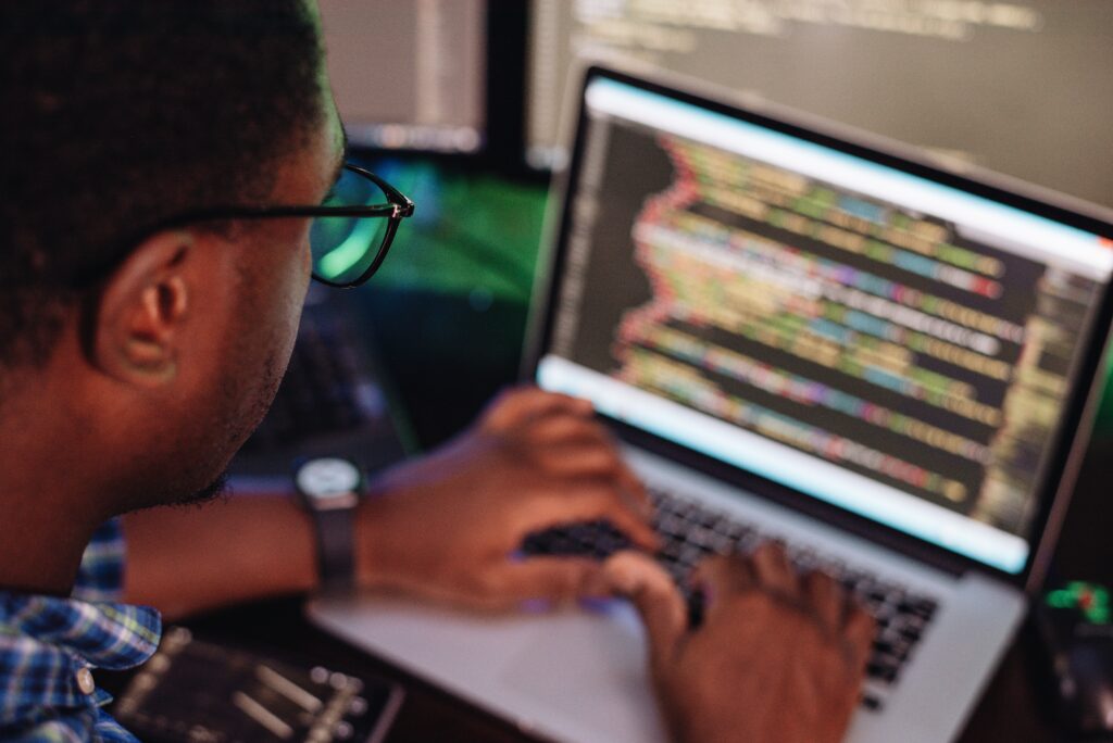 black male in front of computer screen coding mobi 2022 11 15 06 43 22 utc