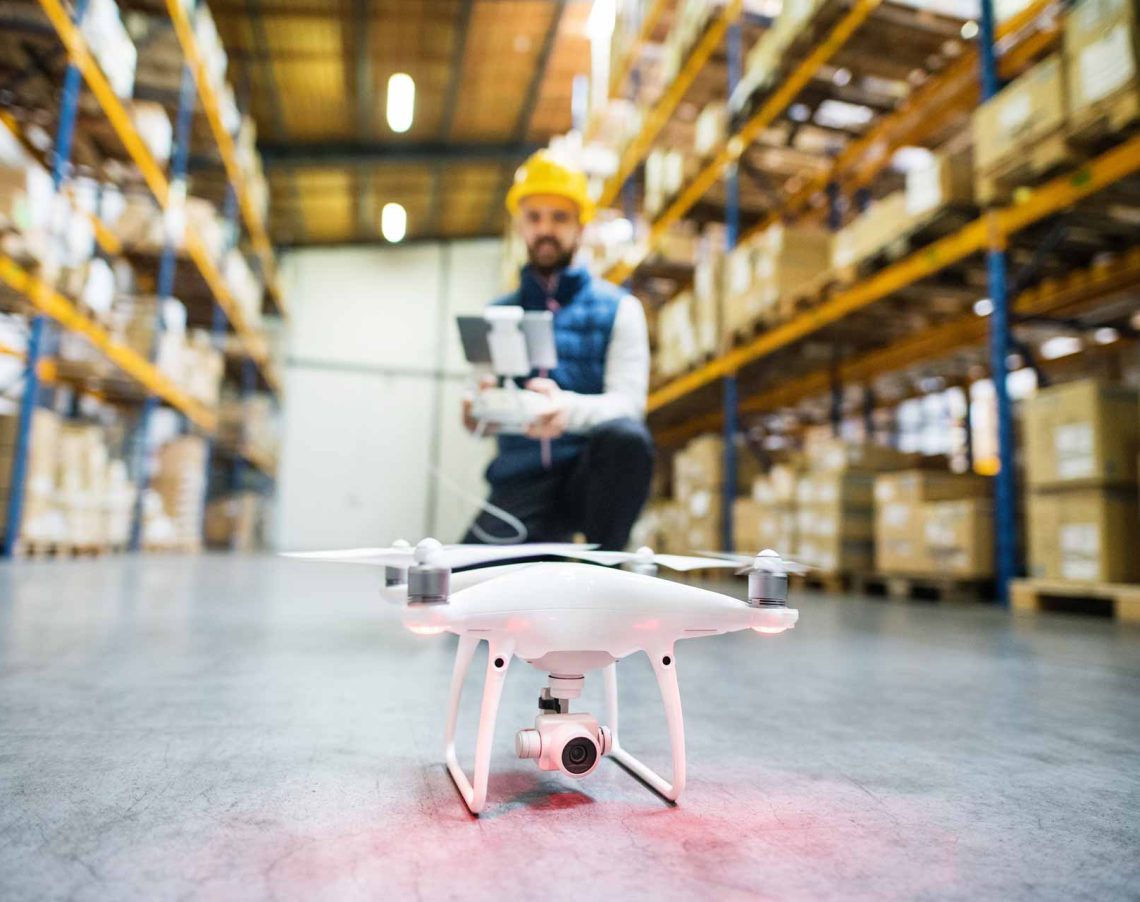 man with drone in a warehouse pmqej35.jpg